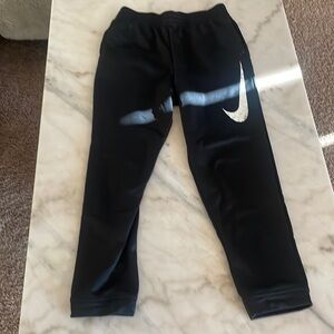 Nike- size: youth large, color: black and white. Condition: barely used.